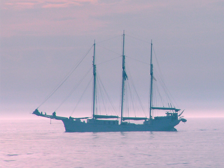 Three-master with its sails down